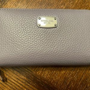 Michael Kors zip around wallet.